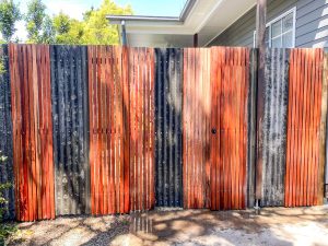 Hardwood Batten fence with Corrugated Iron Infill Panels